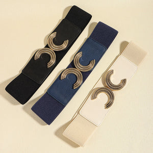 Black, dark blue, and ivory stretch belts with double C gold buckle detail
