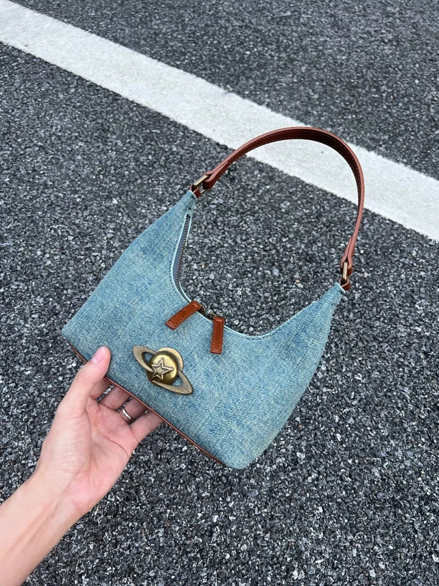 Denim shoulder bag with planet charm and brown strap