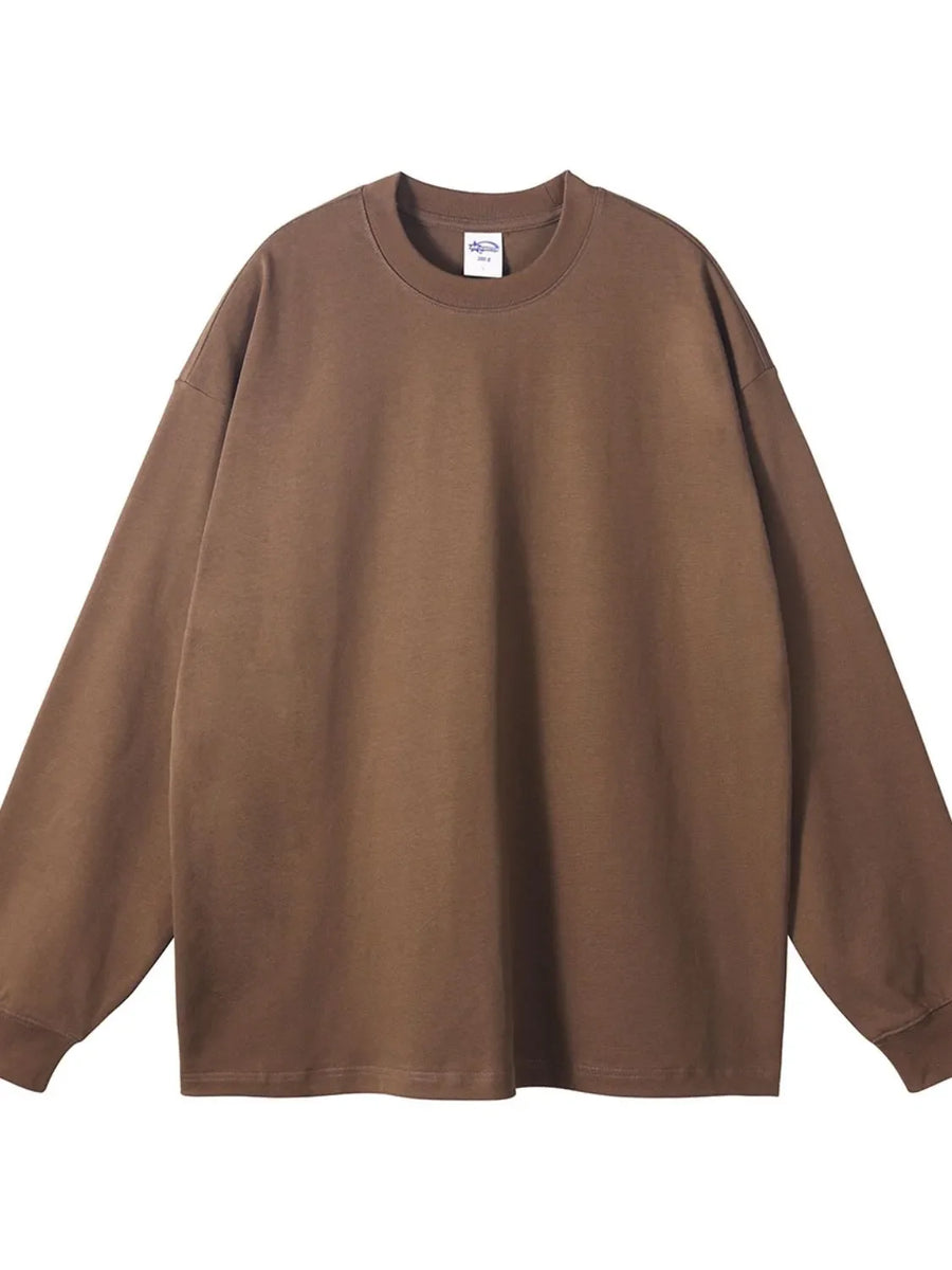 Oversized brown crewneck pullover sweatshirt, 100% cotton, long sleeves, drop shoulders.
