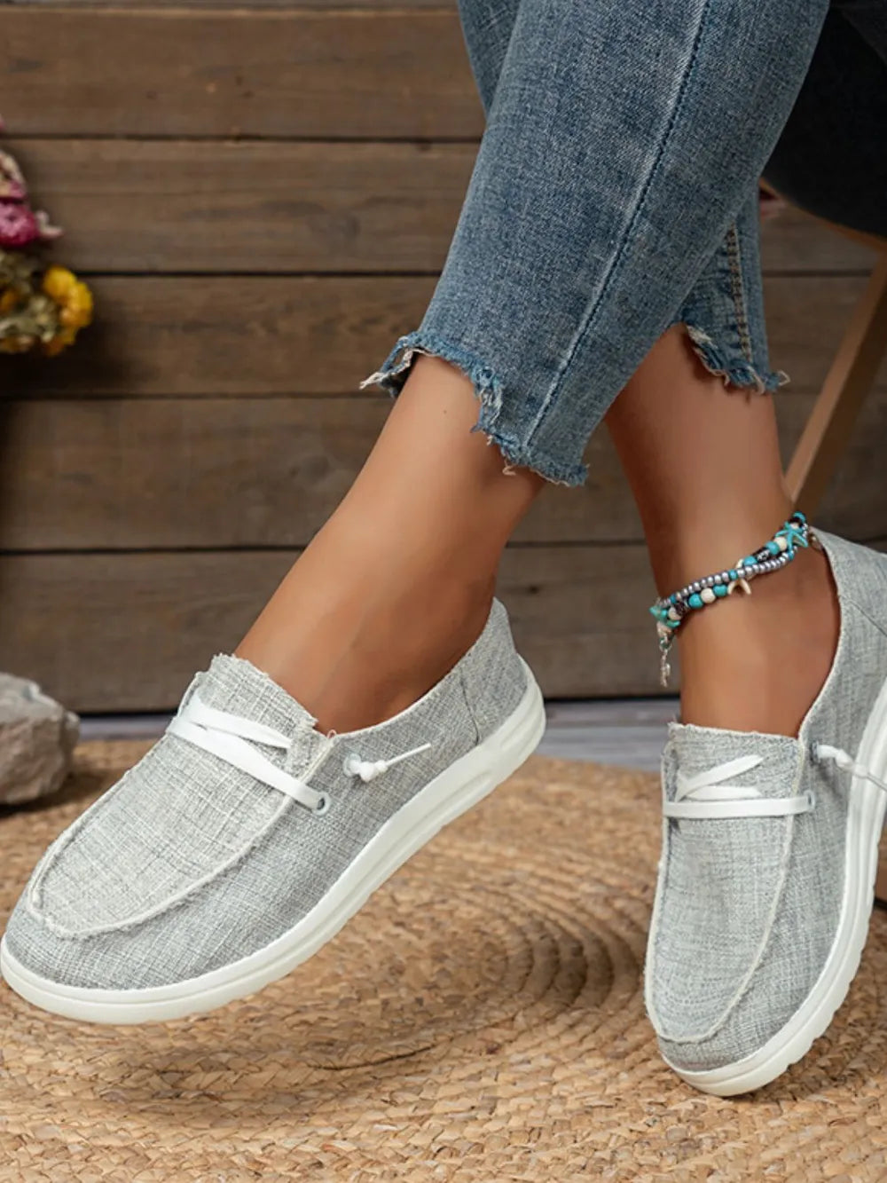 Light Gray textured canvas boat shoe with contrast stitch detail and white laces.