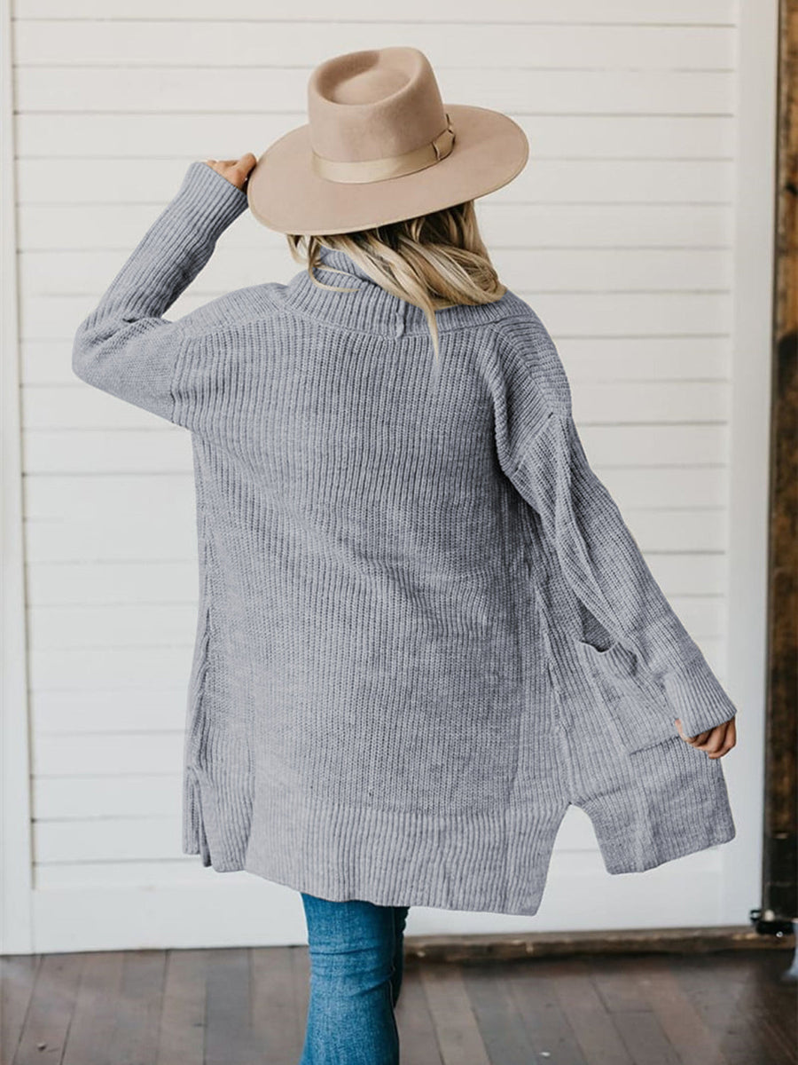 Dark gray ribbed knit cardigan with a drape front, pockets, and side slits.