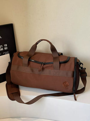 Brown Oxford cloth duffel bag with carry handles and adjustable strap