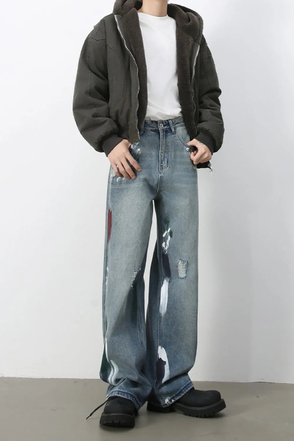 Ink-Blot Wide Leg Denim jeans in medium wash with abstract paint splatters and distressed details.