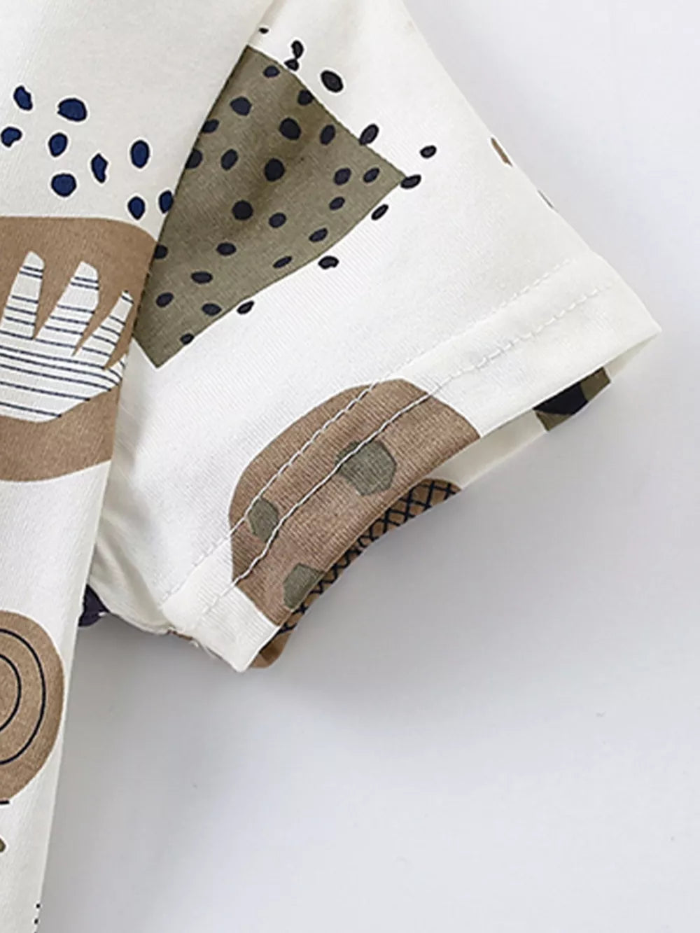 Toddler cotton tee with playful abstract animal print and short sleeves.