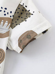 Toddler cotton tee with playful abstract animal print and short sleeves.