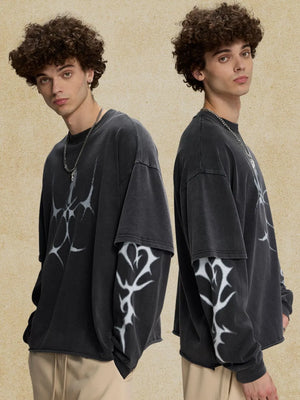 Black distressed graphic tee with layered long sleeves and abstract white print.