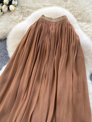 Brown pleated maxi skirt with a comfortable elastic waistband.