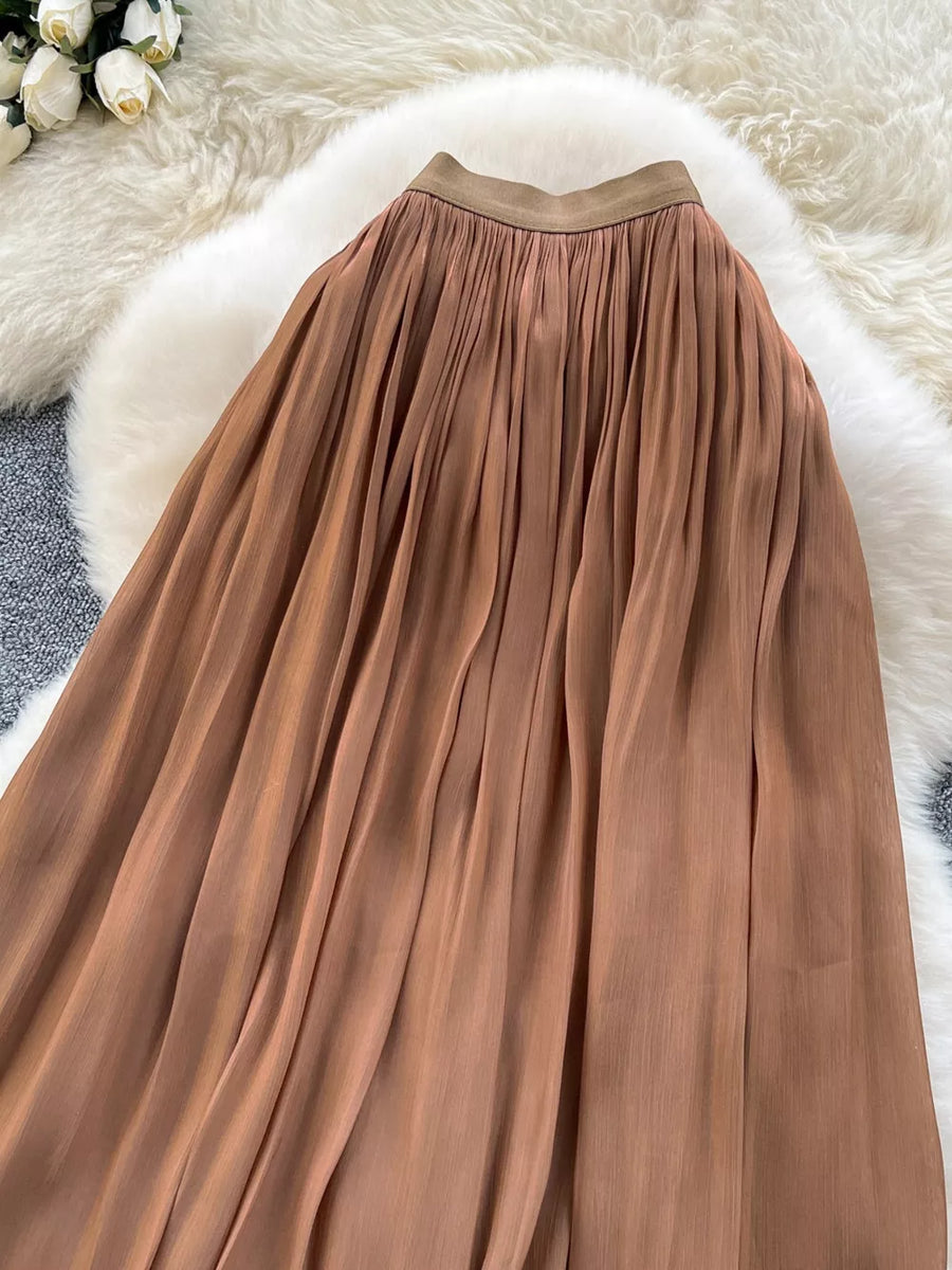 Brown pleated maxi skirt with a comfortable elastic waistband.