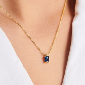 18K gold necklace with a rectangular blue gemstone pendant.