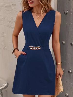 Navy V-neck mini dress with gold chain belt and pockets