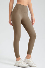 Khaki high-waist performance leggings with sculpted seams and a smooth finish.