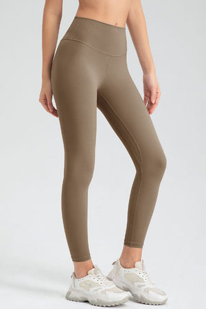 Khaki high-waist performance leggings with sculpted seams and a smooth finish.