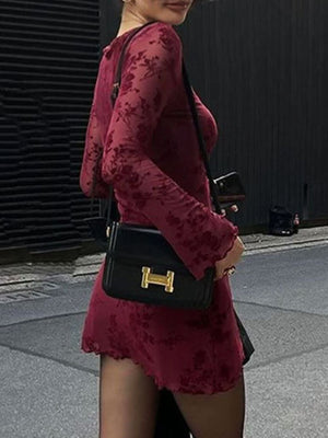 Burgundy floral mesh bodycon mini dress with long sleeves and lettuce hem.