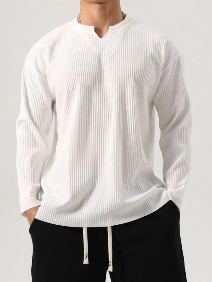 White textured plissé henley long sleeve top with a notched neckline.