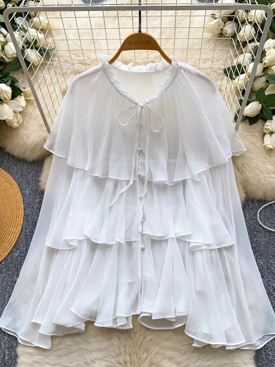 White chiffon tiered blouse with ruffled neckline and bow tie detail