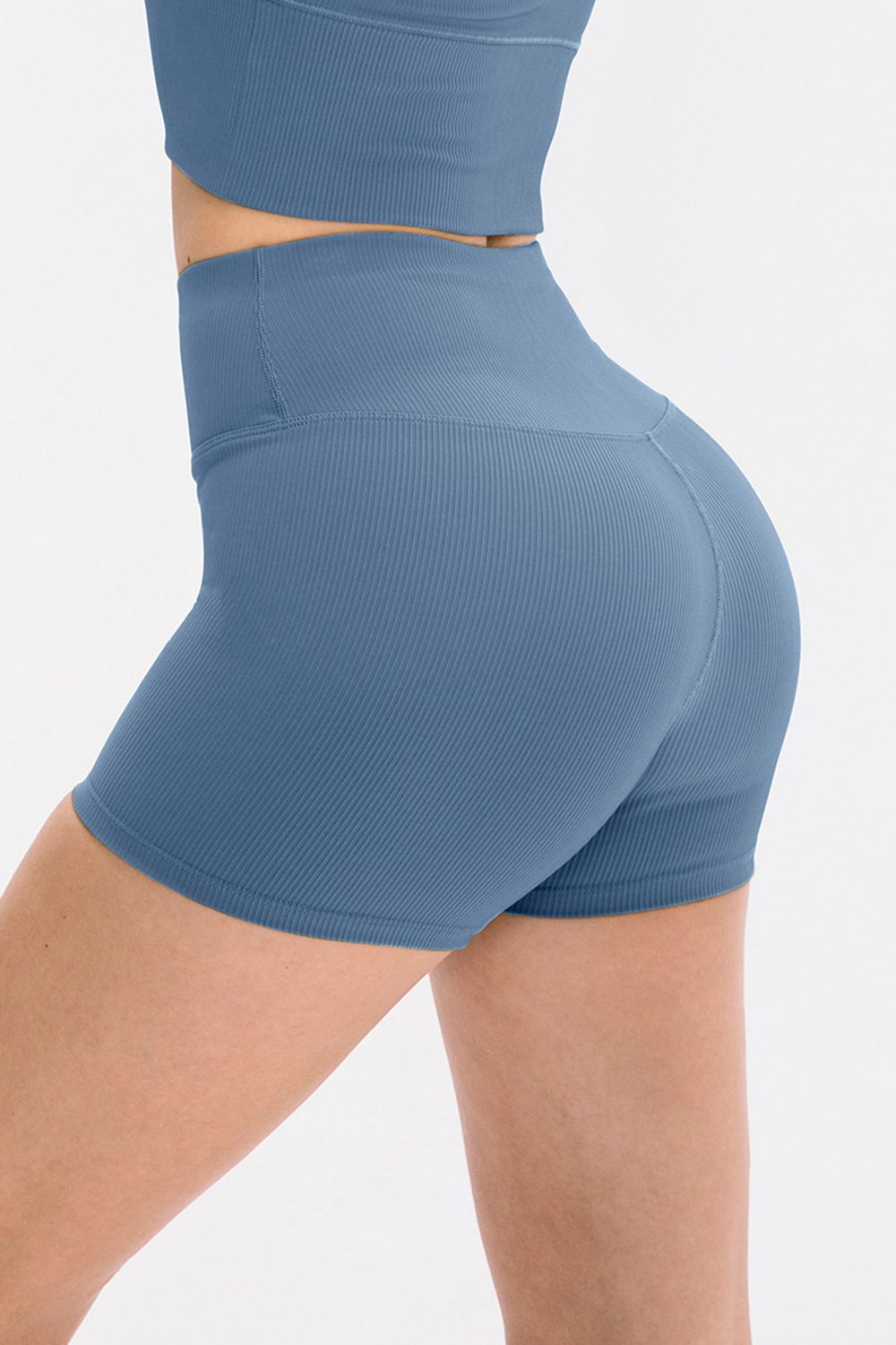 Light blue ribbed sculpting active shorts with a high waist and v-seam detail.