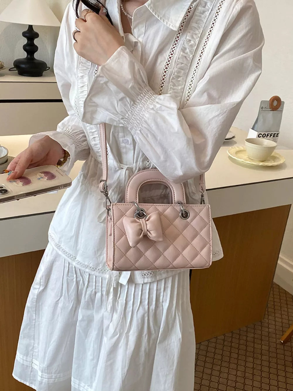 crossbody bag in blush pink featuring quilted and boxy fit