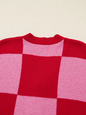 Checkerboard knit cardigan in deep rose and pink with a crew neck.