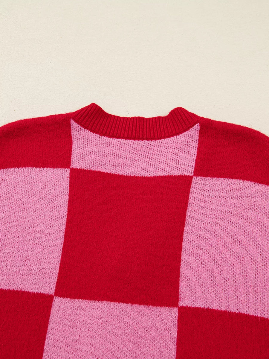 Checkerboard knit cardigan in deep rose and pink with a crew neck.