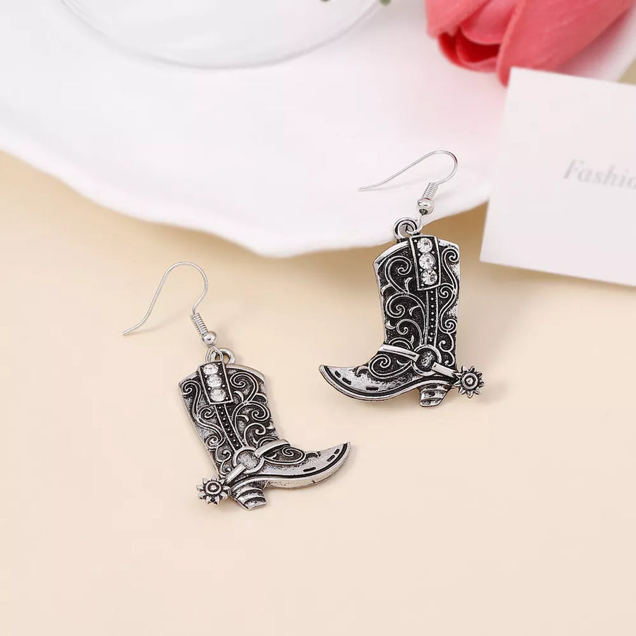 Silver earrings featuring dangle and ornamental