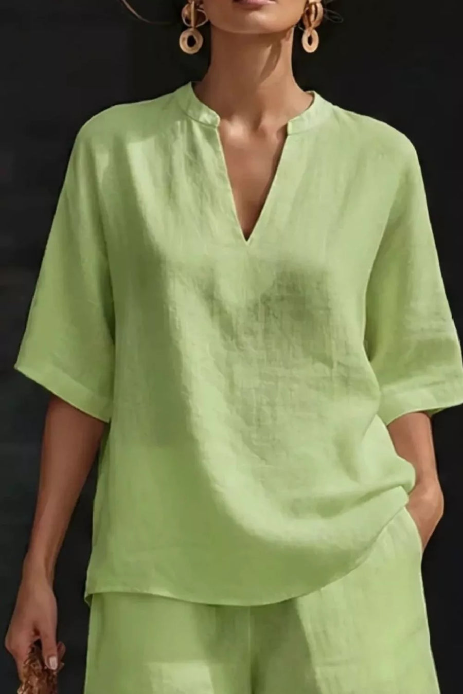 Light Green notched top with V-neck and short sleeves, paired with matching pocketed shorts.