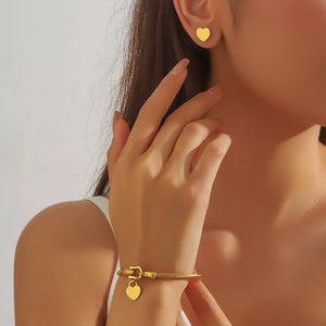 gold jewelry set with heart motif and not applicable