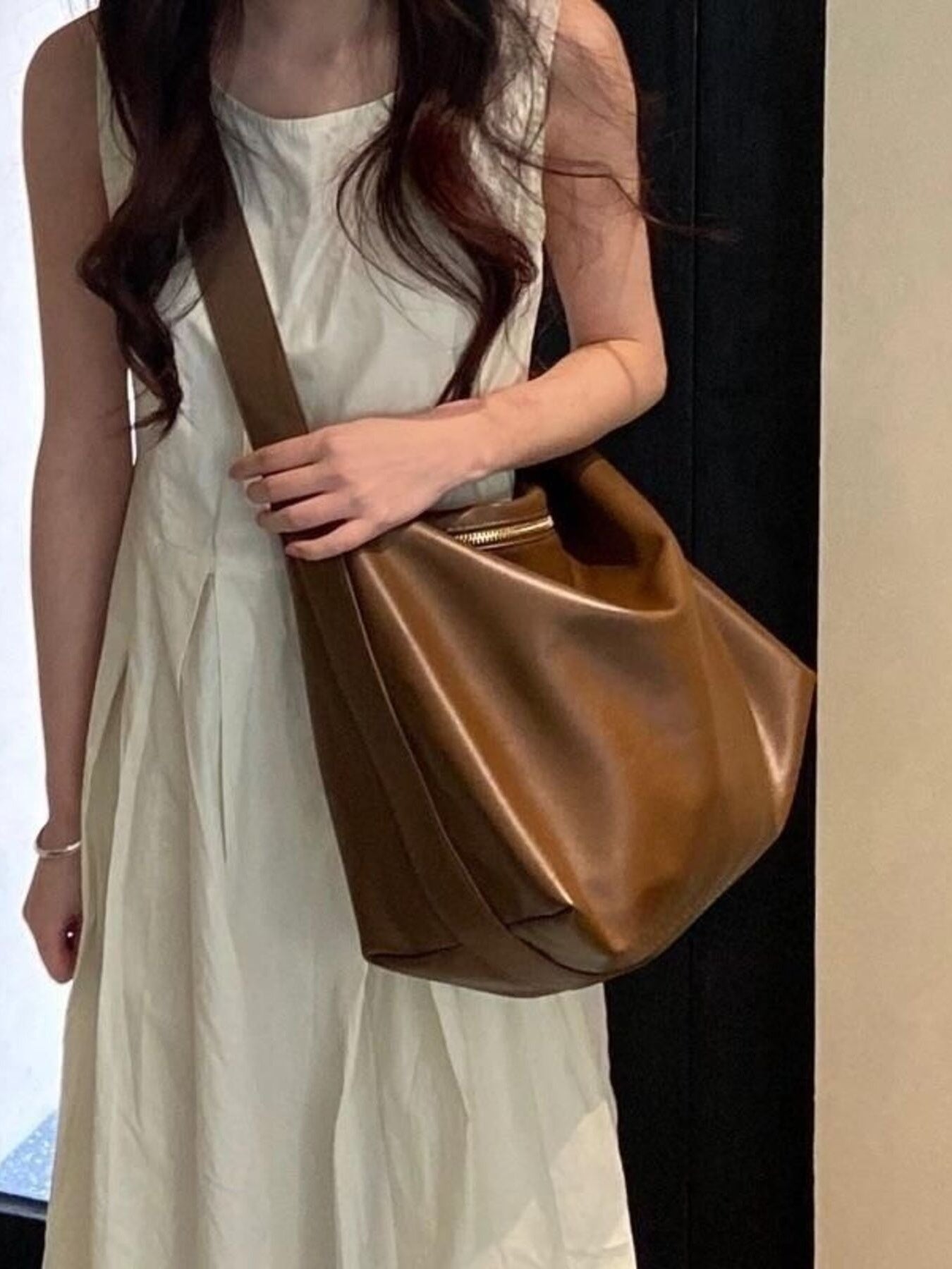Large brown pu leather crossbody bag with a zipper closure and adjustable strap.