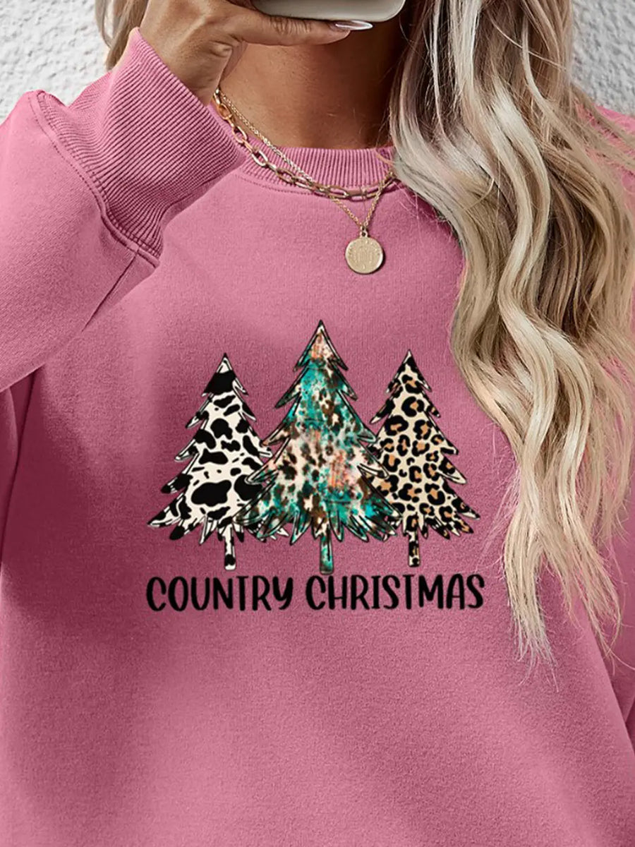 Blush pink graphic sweatshirt with country Christmas trees in cow print, leopard print, and teal.