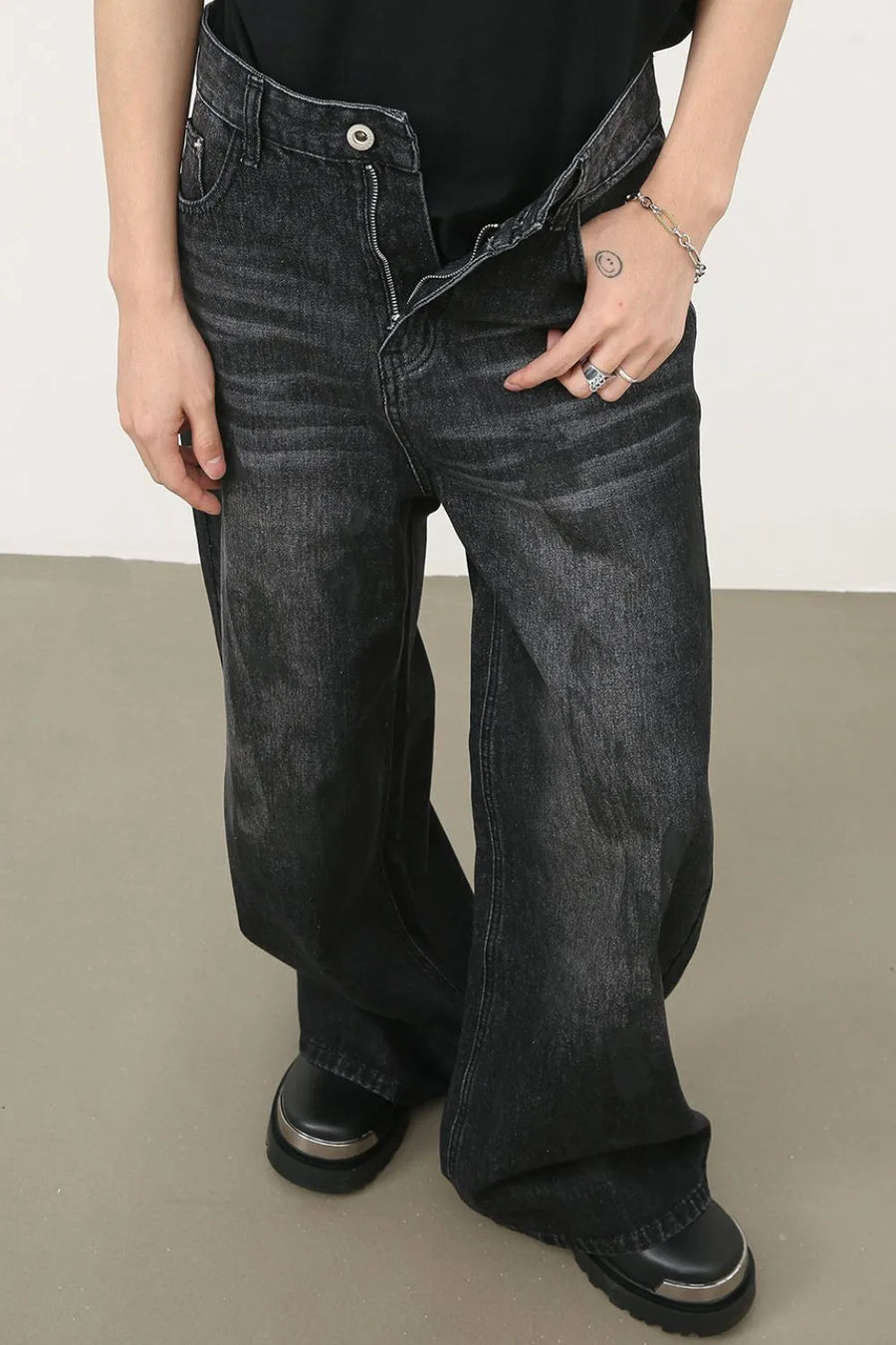 Oversized charcoal wash denim jeans with a relaxed fit and wide leg.