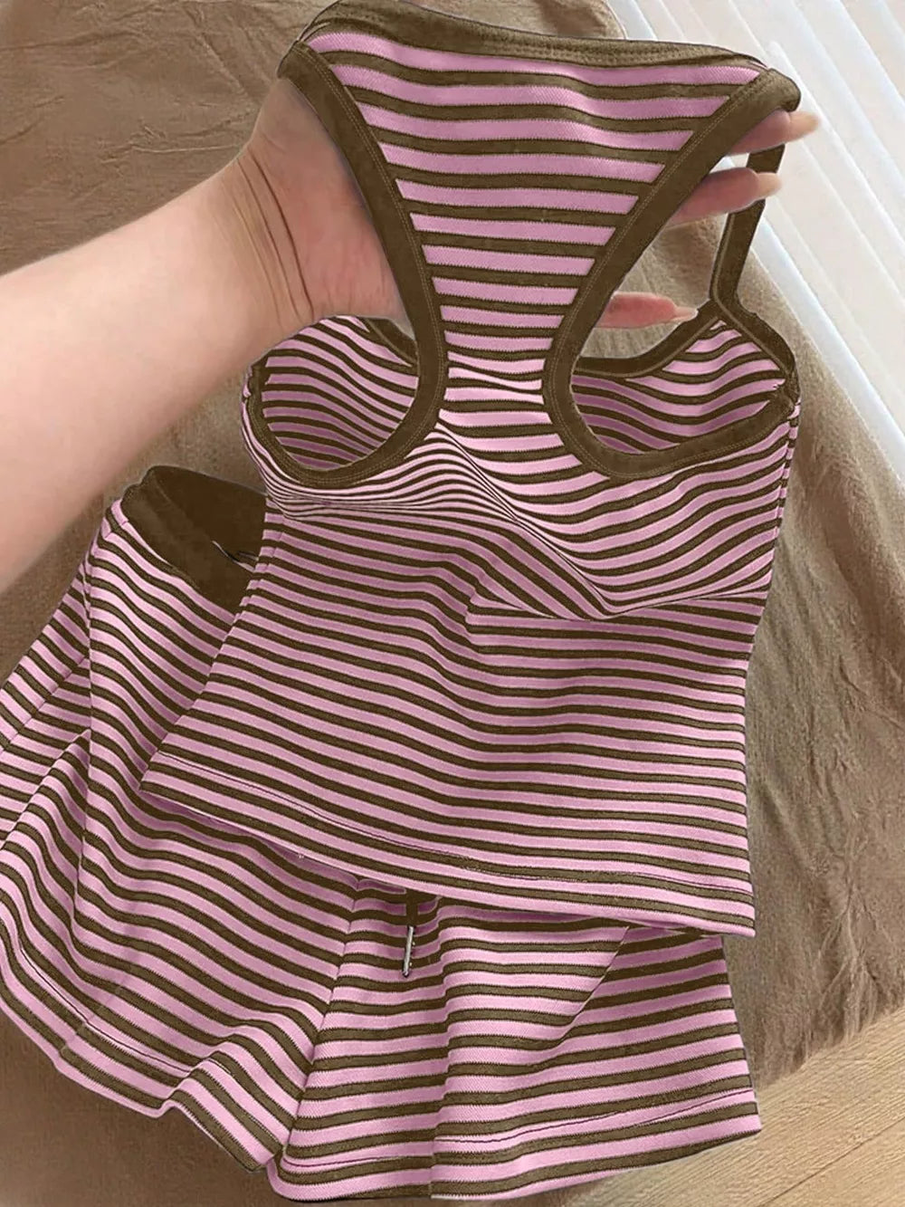 Pink and brown striped tank top and shorts set with drawstring shorts.