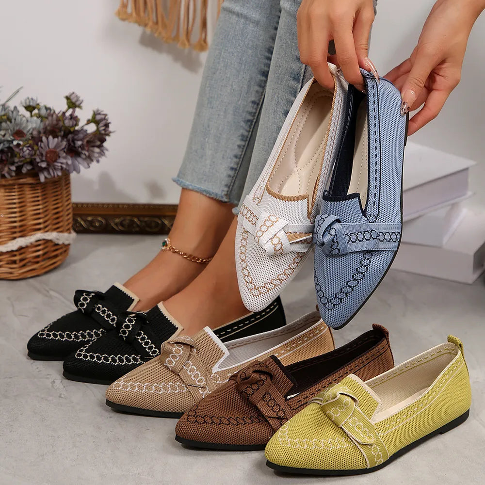 Chain-stitched knit bow pointed flats in black, white, chartreuse, khaki, dusty blue, and brown.