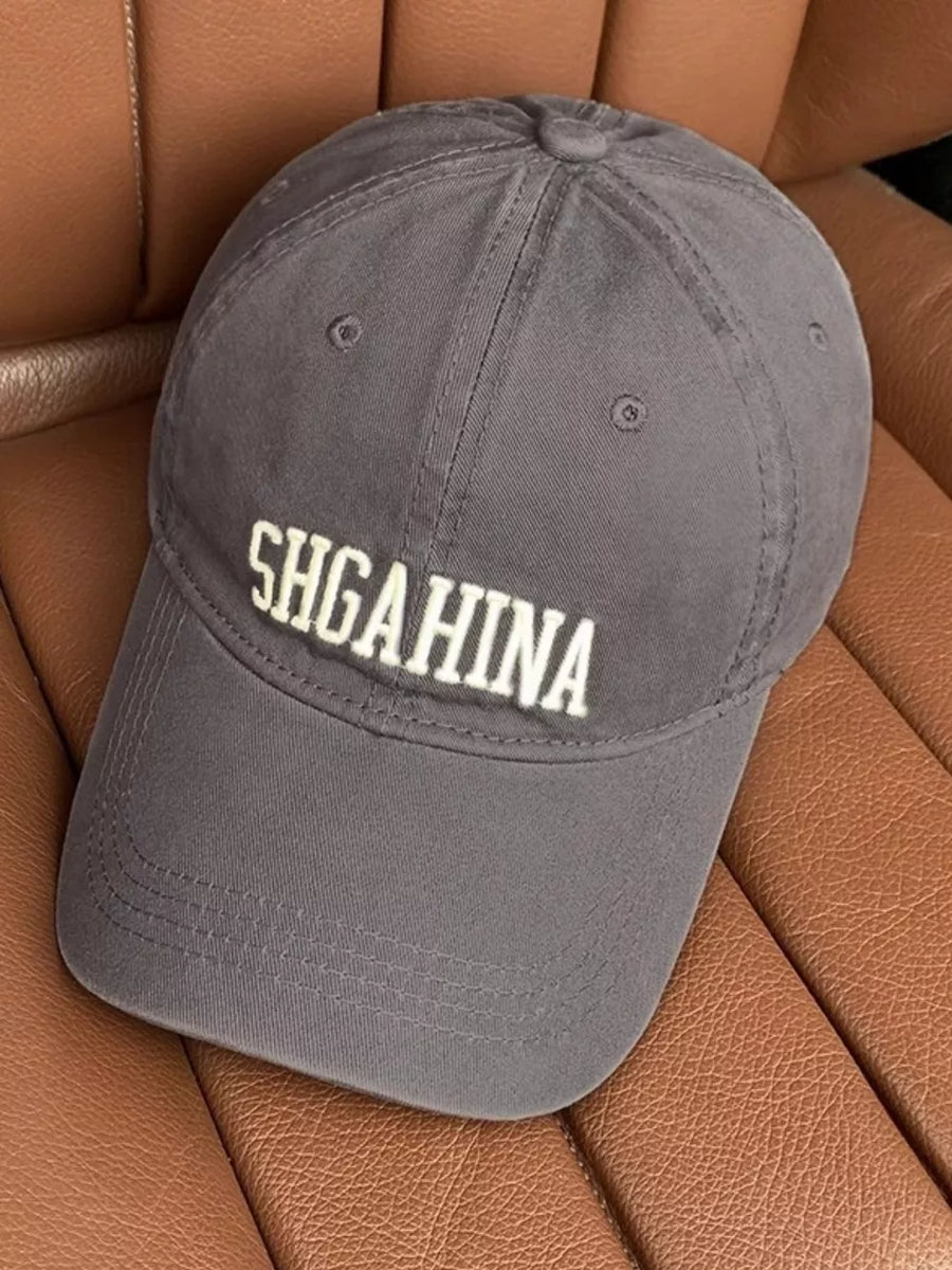 Grey cotton baseball cap with mirrored letter embroidery and curved brim.