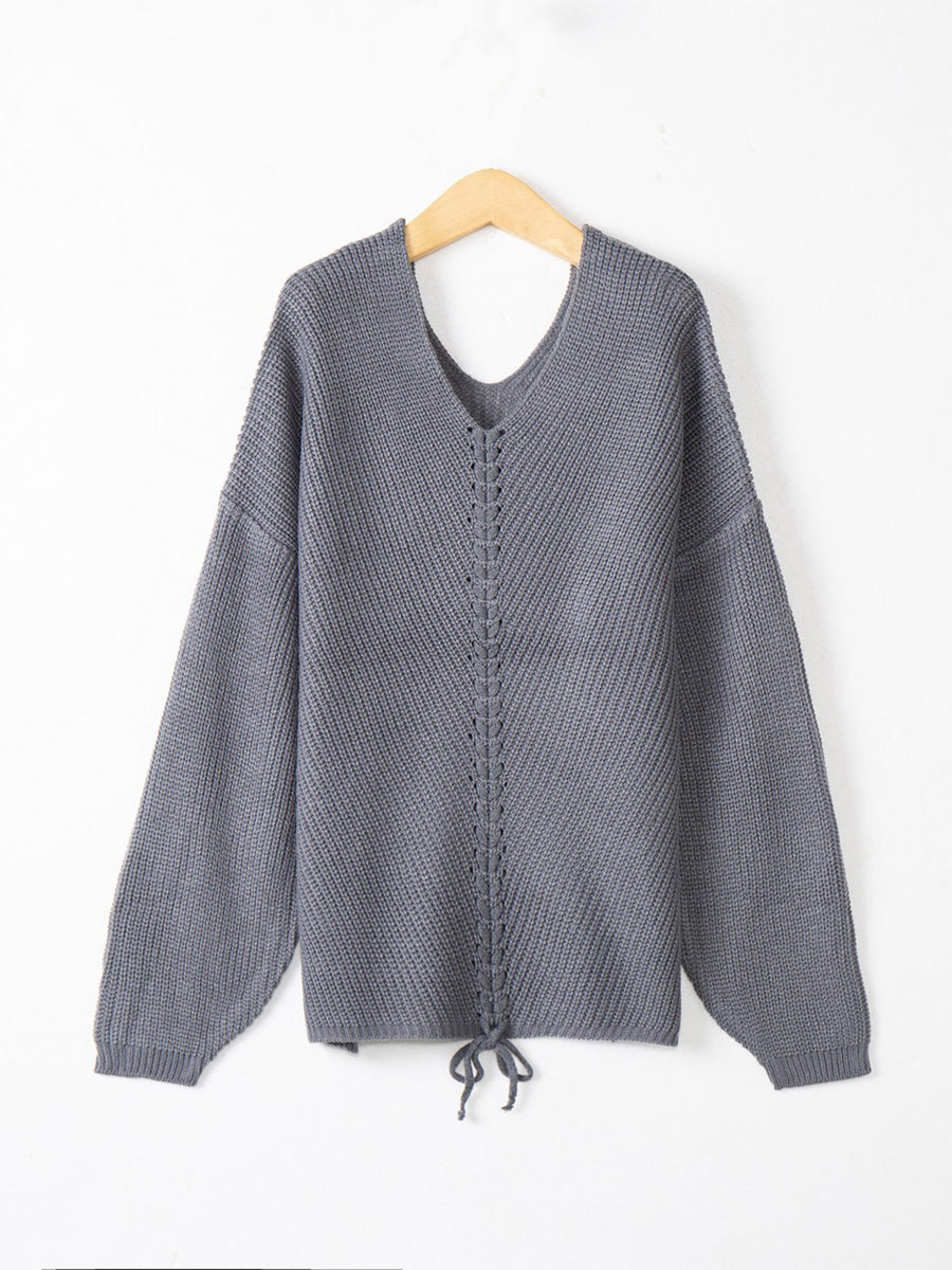 Dark Gray knit sweater with V-neck and lace-up detail at hem.