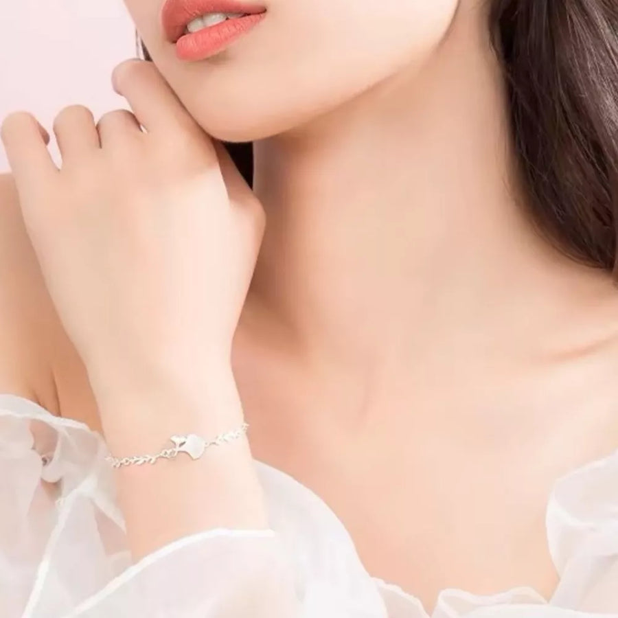 Silver bracelet featuring ginkgo leaf charm and ginkgo leaf
