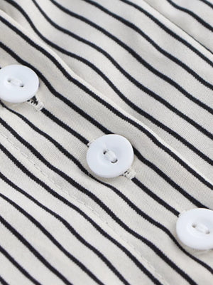 Maternity shirt with black and white stripes and white buttons.
