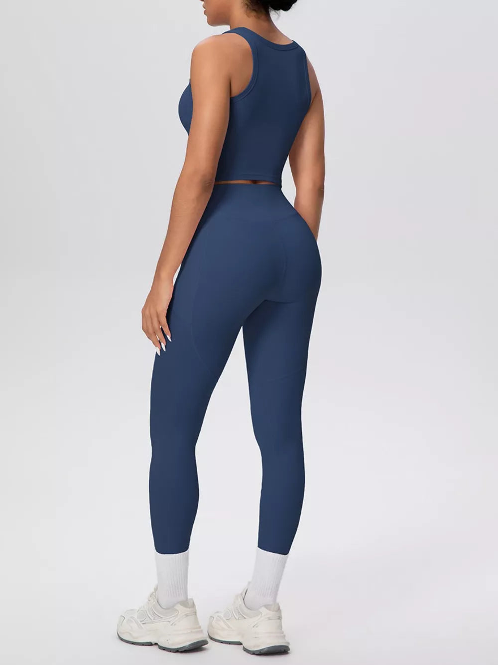 80% nylon, 20% spandex Care instructions: Machine wash cold athletic tank in Dusty Blue with fitted silhouette
