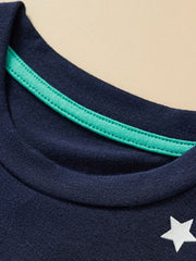 Children's dark navy crew neck t-shirt with a white star detail and green trim.