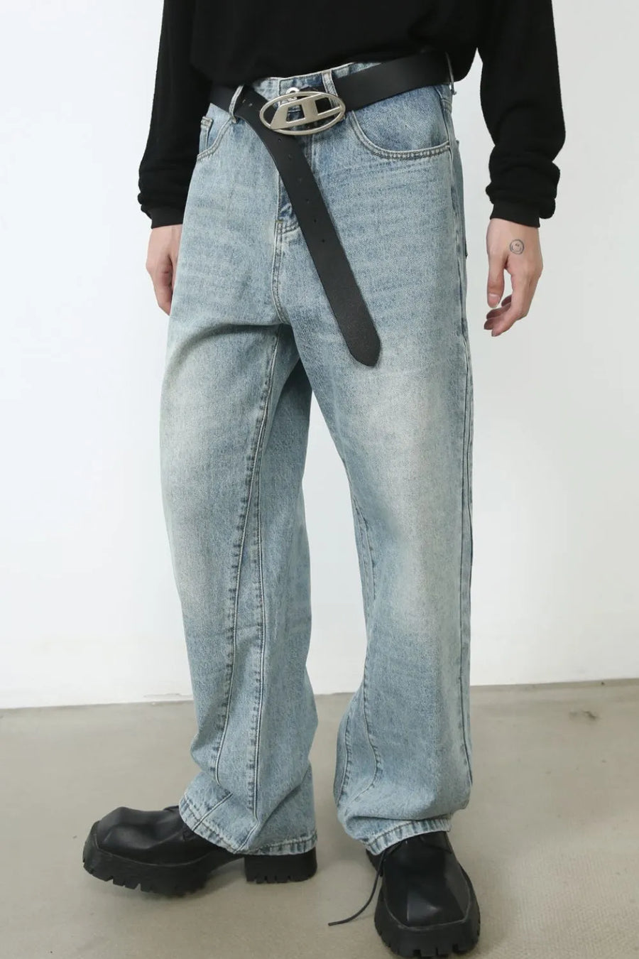 Wide-leg denim jeans in medium wash with subtle seam detail