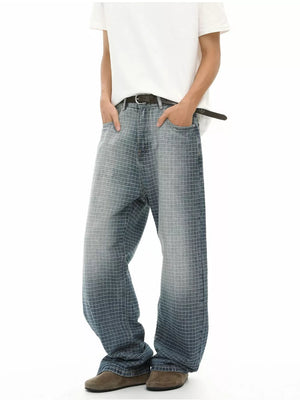 Men's relaxed-fit jeans in blue denim with a subtle grid pattern and buttoned closure.