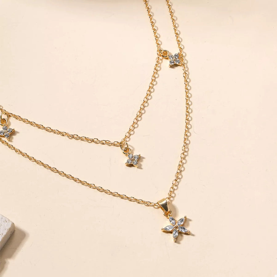 Gold double layer necklace with star charms and crystal accents