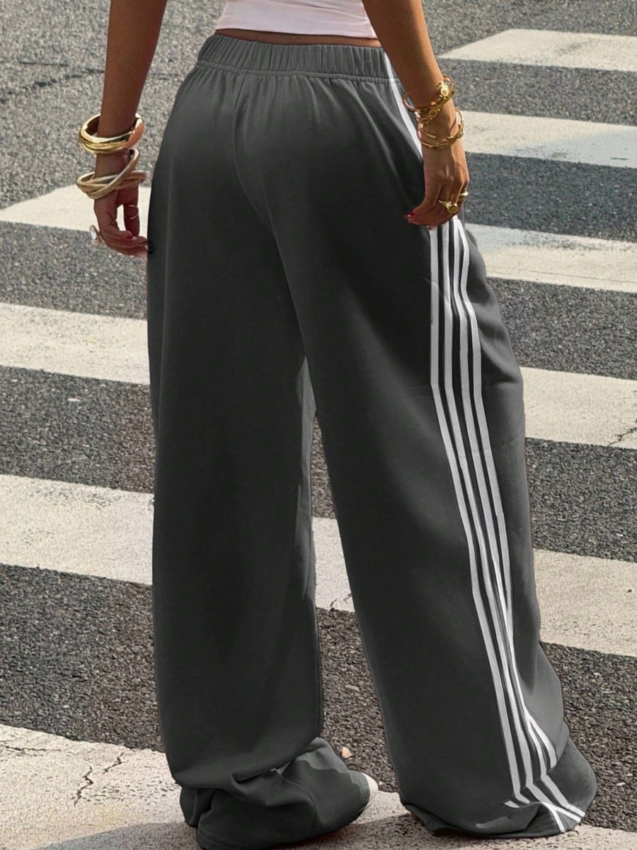 track pants in yellow with high-waisted and full-length