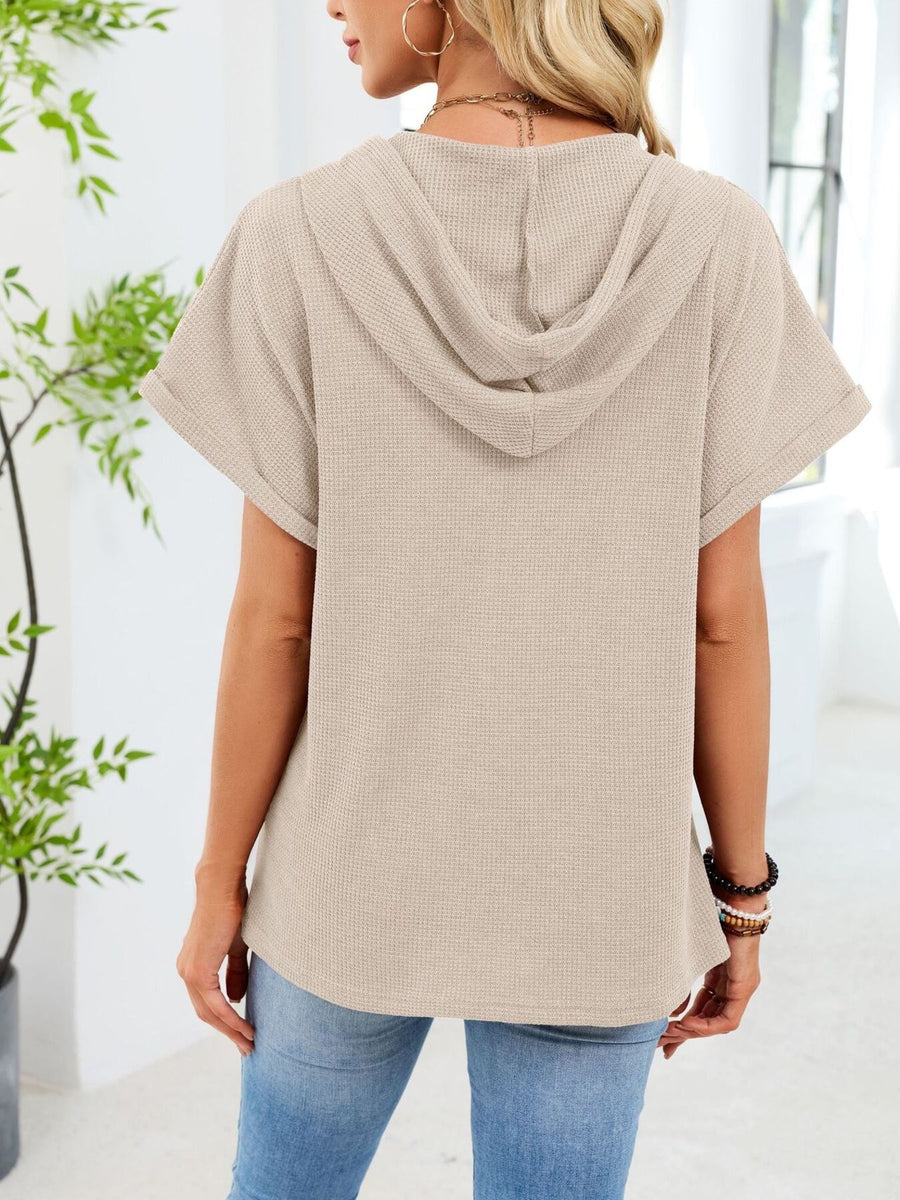 Apricot waffle knit short sleeve hooded top with cuffed sleeves.