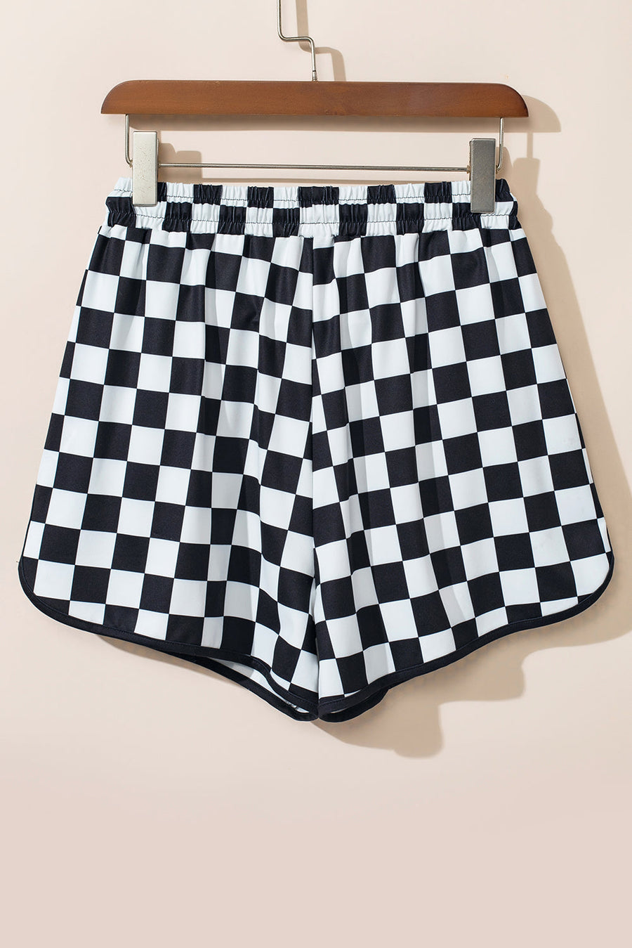 Black and white checkerboard lounge shorts with black trim and elastic waistband.