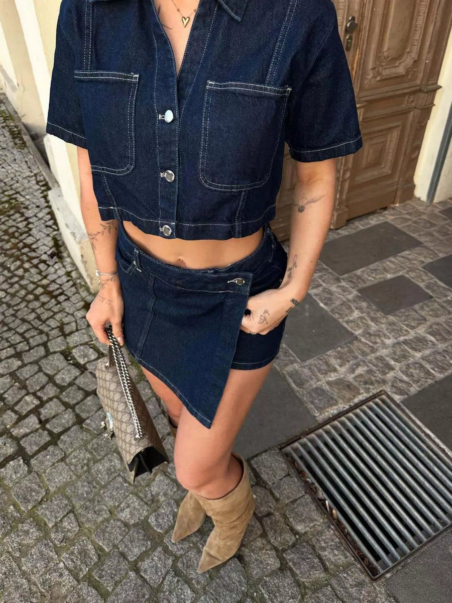 Dark blue cotton cropped button-up top and skort set with contrast stitching.
