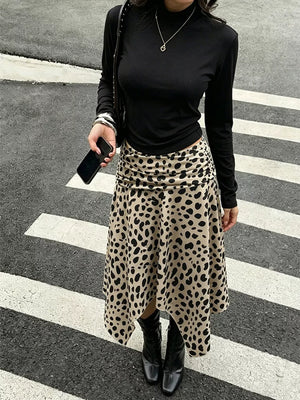 Leopard print midi skirt with asymmetrical hem and ruched side detail.