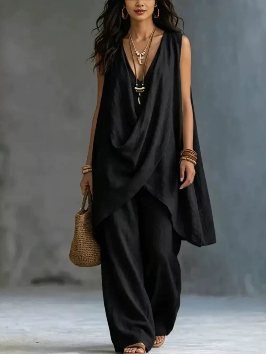 Black asymmetrical top and wide-leg pants set with deep V-neck and sleeveless design