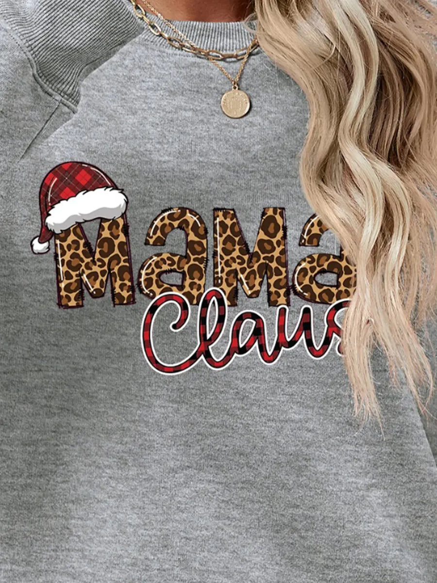Crewneck sweatshirt with leopard print "Mama Claus" graphic and Santa hat detail.