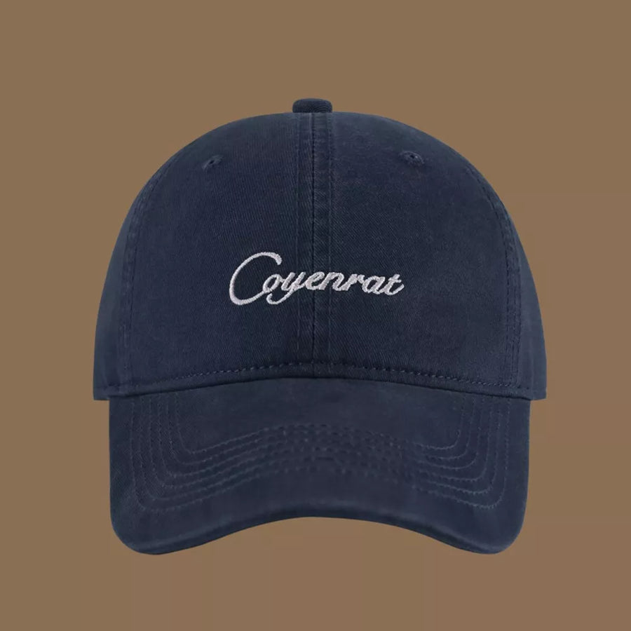 Navy baseball cap with white embroidered text.