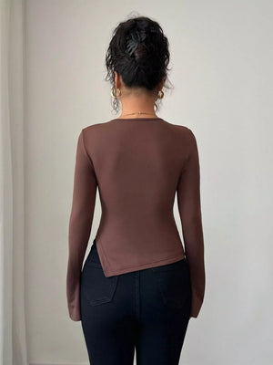 Brown long-sleeve top with asymmetrical hem and cutout detail