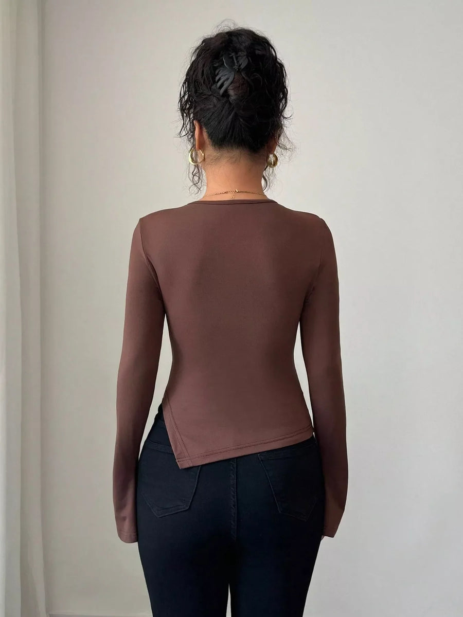 Brown long-sleeve top with asymmetrical hem and cutout detail
